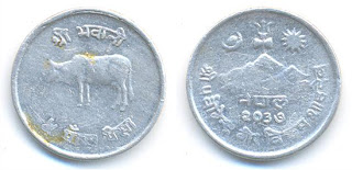 Una de las monedas del cubo (algo más limpia)